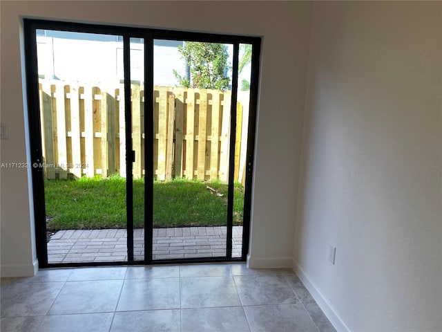 entryway with light tile patterned floors