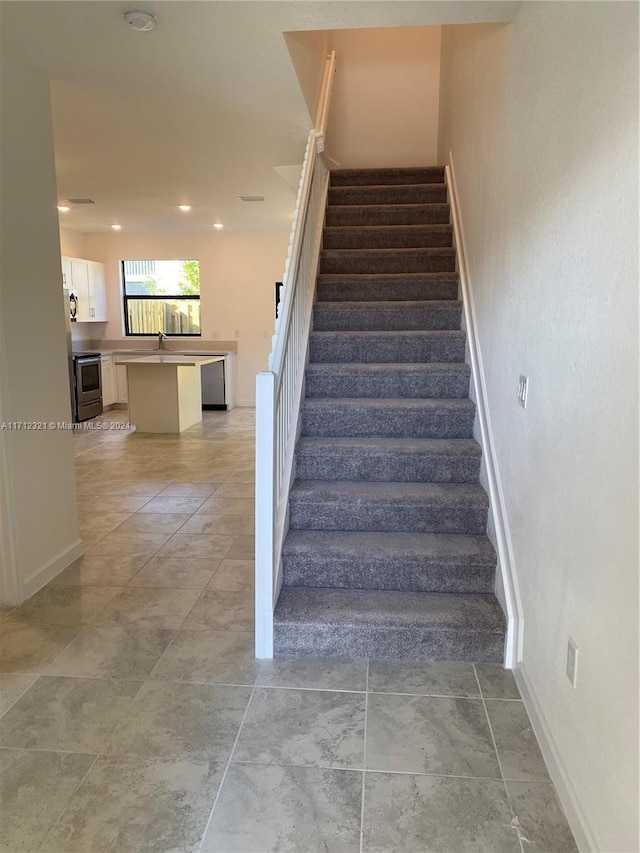 staircase with sink