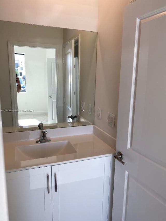 bathroom with vanity and a healthy amount of sunlight