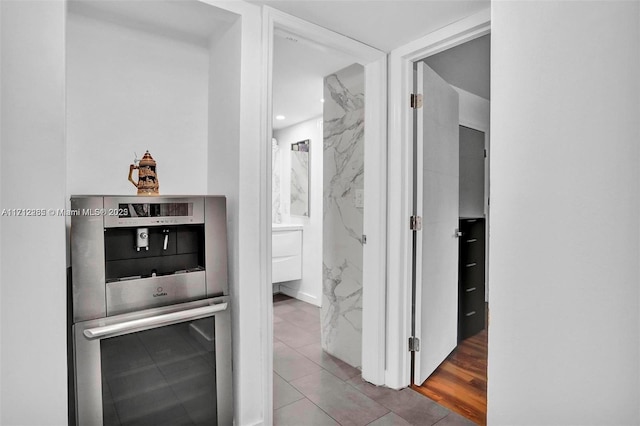 hall featuring tile patterned floors