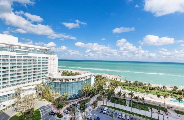 aerial view with a water view and a view of the beach