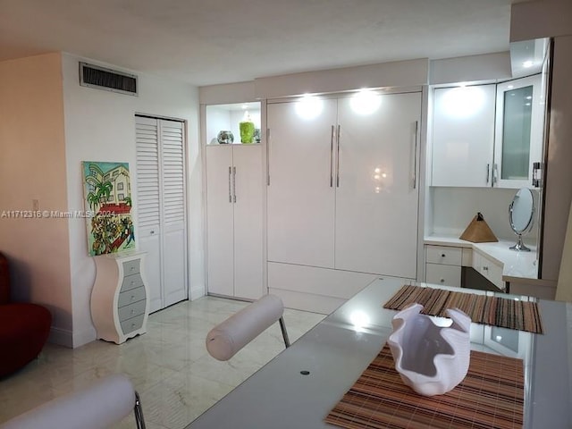 interior space featuring white cabinets