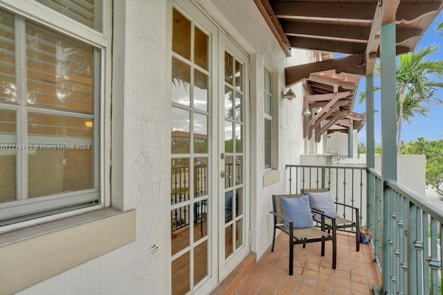 balcony featuring french doors