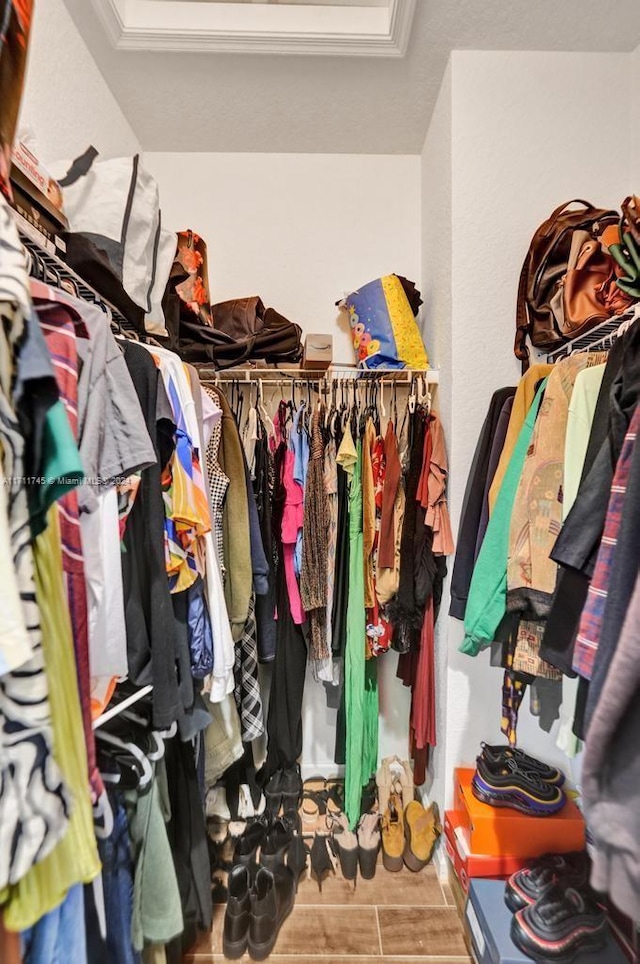 spacious closet featuring hardwood / wood-style flooring