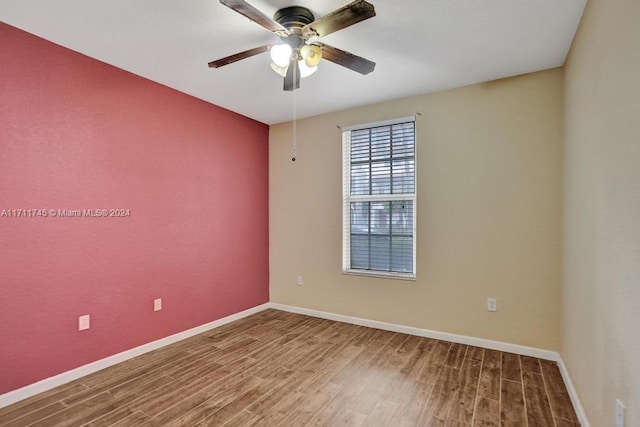 spare room featuring ceiling fan and wood-type flooring