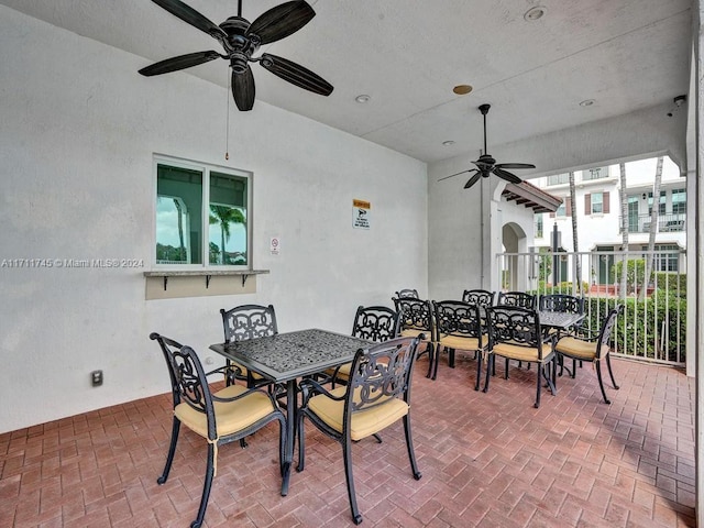 exterior space featuring ceiling fan