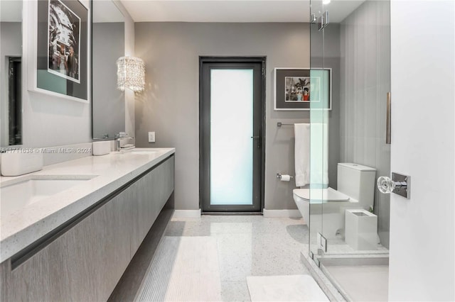 bathroom featuring vanity, toilet, and walk in shower