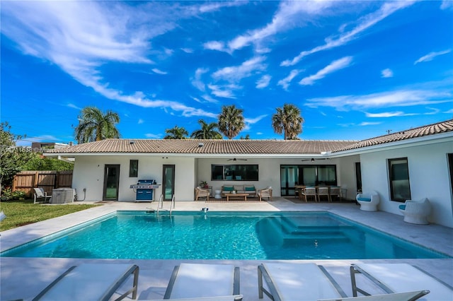 back of property featuring an outdoor living space, ceiling fan, and a patio