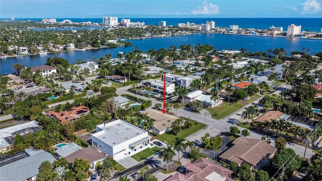 birds eye view of property featuring a water view