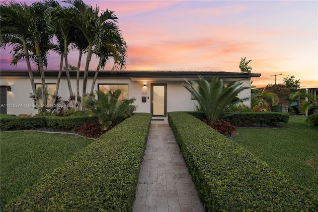 view of front of house with a lawn