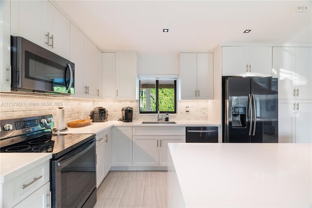 kitchen with white cabinetry, appliances with stainless steel finishes, and sink