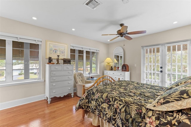 bedroom with visible vents, access to outside, french doors, light wood finished floors, and baseboards