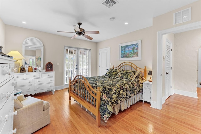 bedroom featuring access to outside, baseboards, visible vents, and light wood finished floors