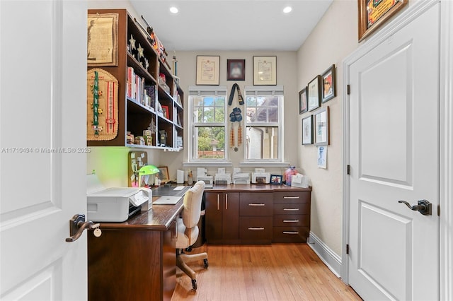 office area with recessed lighting, light wood-type flooring, and baseboards