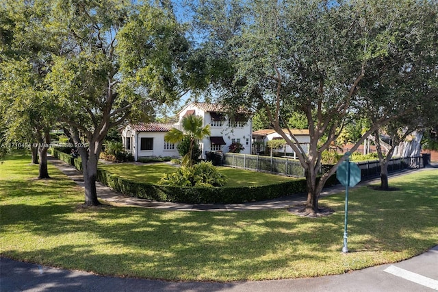 exterior space featuring a yard and fence