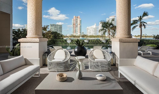 view of patio featuring an outdoor living space and a city view