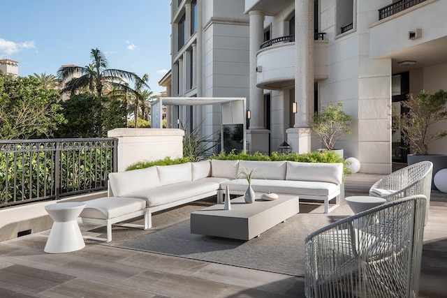 view of patio / terrace featuring an outdoor hangout area and a balcony