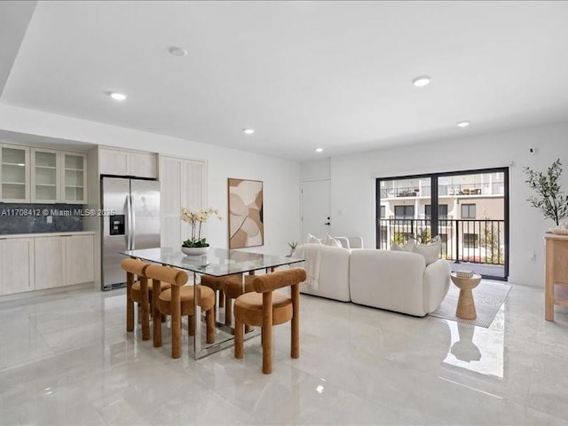 dining room featuring recessed lighting and marble finish floor