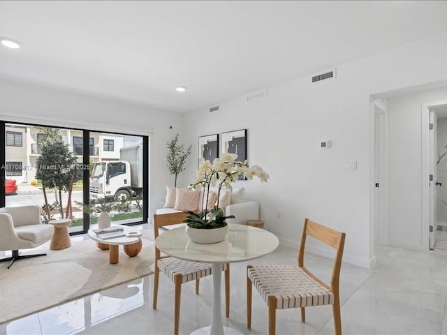 dining space featuring baseboards, visible vents, and recessed lighting