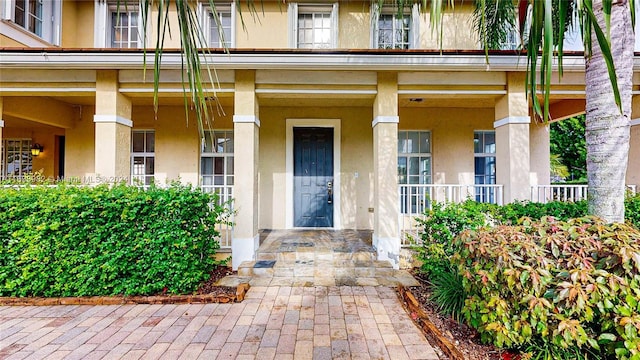 doorway to property with covered porch