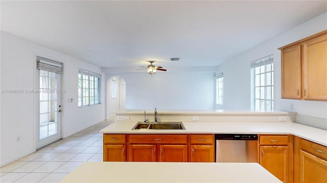 kitchen featuring ceiling fan, dishwasher, light tile patterned flooring, and sink