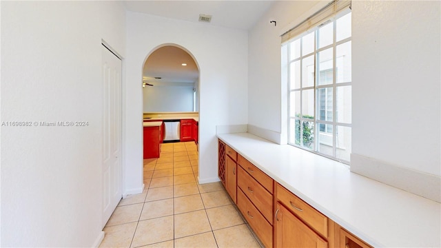 hallway featuring light tile patterned floors