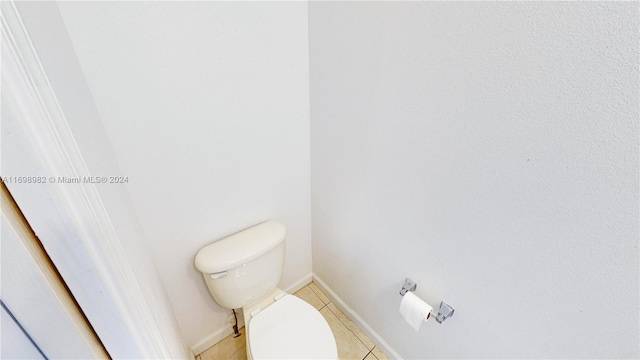 bathroom with tile patterned flooring and toilet