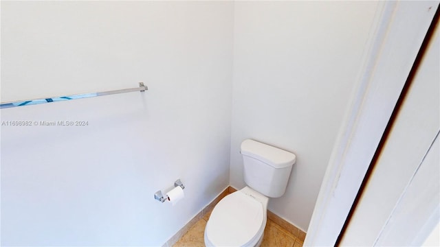 bathroom featuring tile patterned floors and toilet