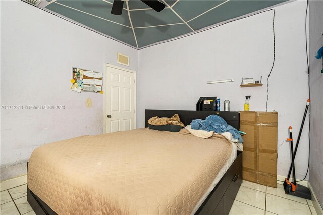 bedroom with light tile patterned flooring