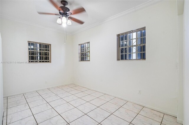 spare room featuring ceiling fan and crown molding