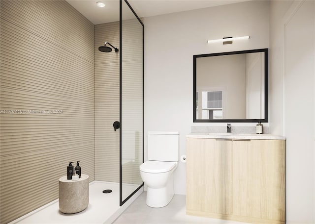 bathroom with toilet, a tile shower, vanity, and tile patterned floors