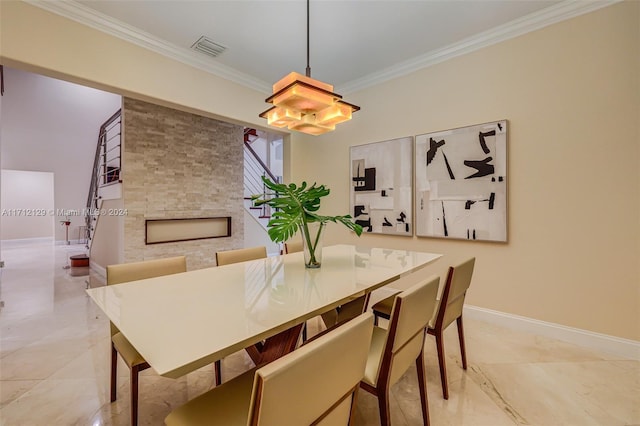 dining area featuring crown molding