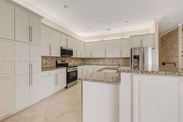 kitchen with light stone countertops, stainless steel appliances, ornamental molding, and sink