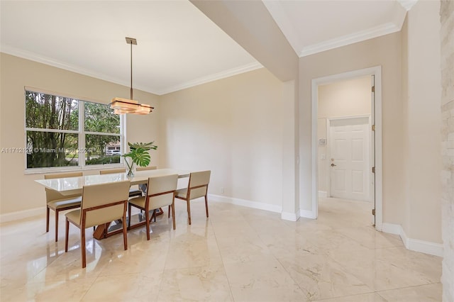 dining room featuring crown molding