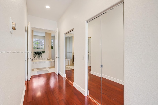 hall featuring dark wood-type flooring