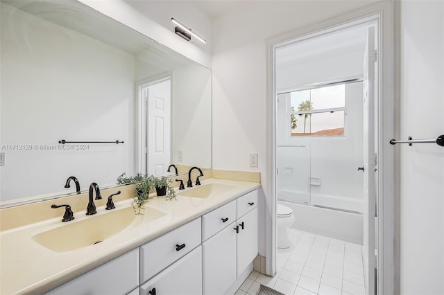 full bathroom with tile patterned flooring, vanity, toilet, and shower / bath combination with glass door