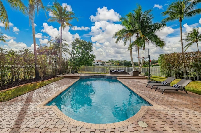 view of swimming pool with a patio