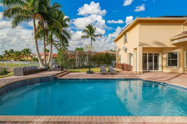 view of pool featuring a patio area and pool water feature