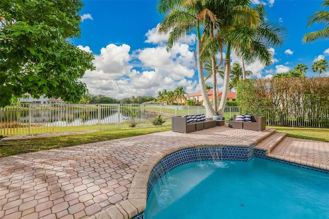 view of pool with pool water feature, a water view, and a patio