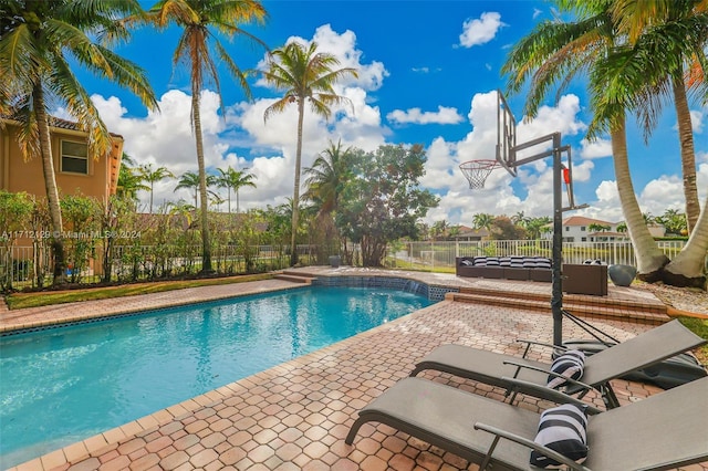 view of swimming pool with a patio area