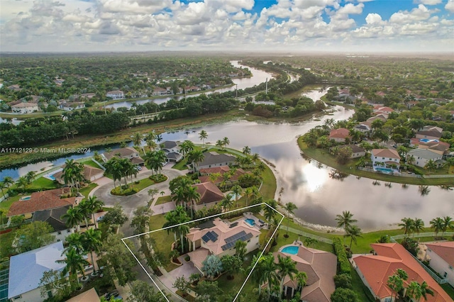 birds eye view of property with a water view