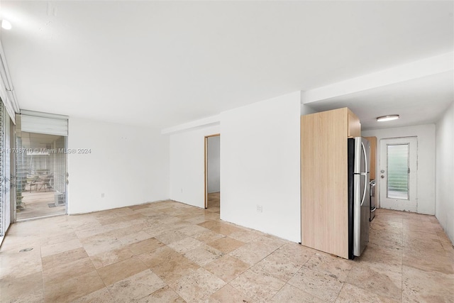 1155 103rd St Unit 7A, Bay Harbor Islands, FL 33154 - spare room with stone tile flooring