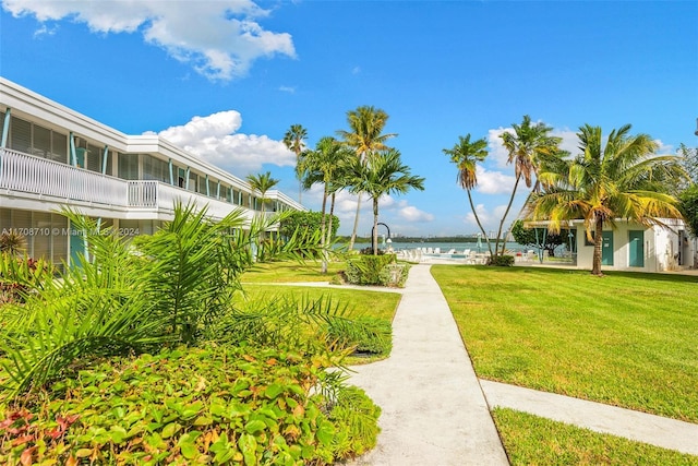 1155 103rd St Unit 7A, Bay Harbor Islands, FL 33154 - view of community featuring a yard and a water view