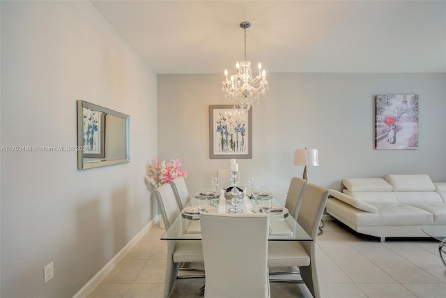 dining space featuring a chandelier and light tile patterned floors