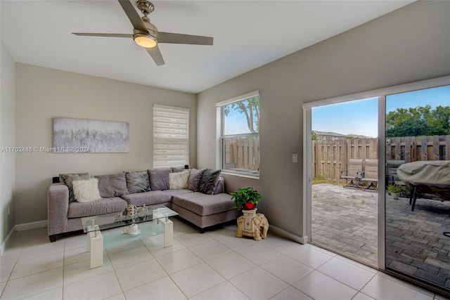 tiled living room with ceiling fan