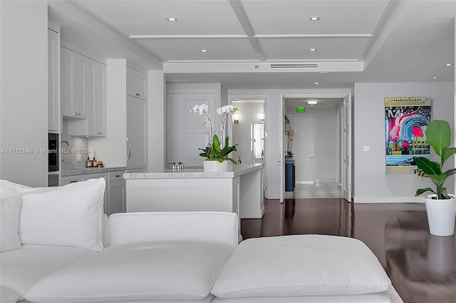 kitchen featuring white cabinets and dark wood-type flooring