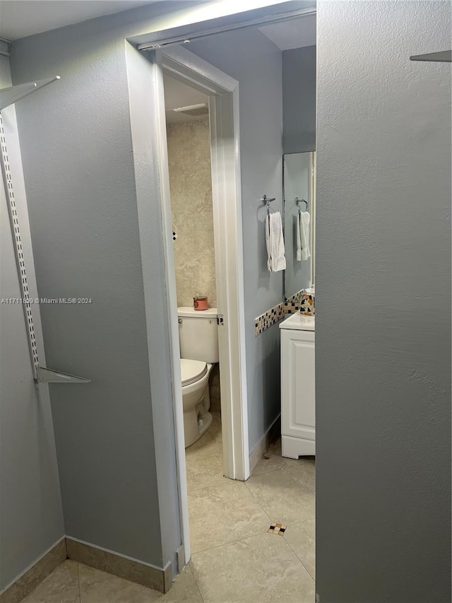 bathroom featuring tile patterned flooring and toilet