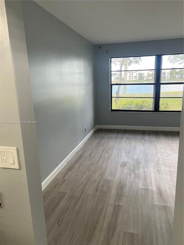 spare room featuring hardwood / wood-style floors