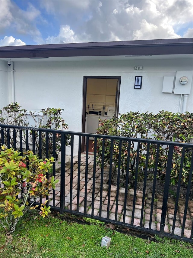 entrance to property with washer / dryer