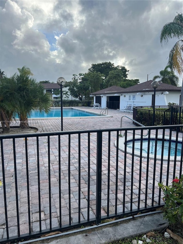 view of swimming pool with a patio